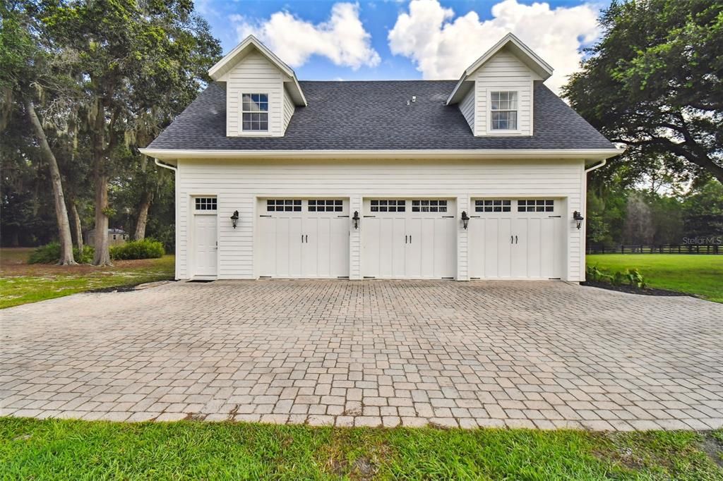 stairs lead to apartment above three car garage