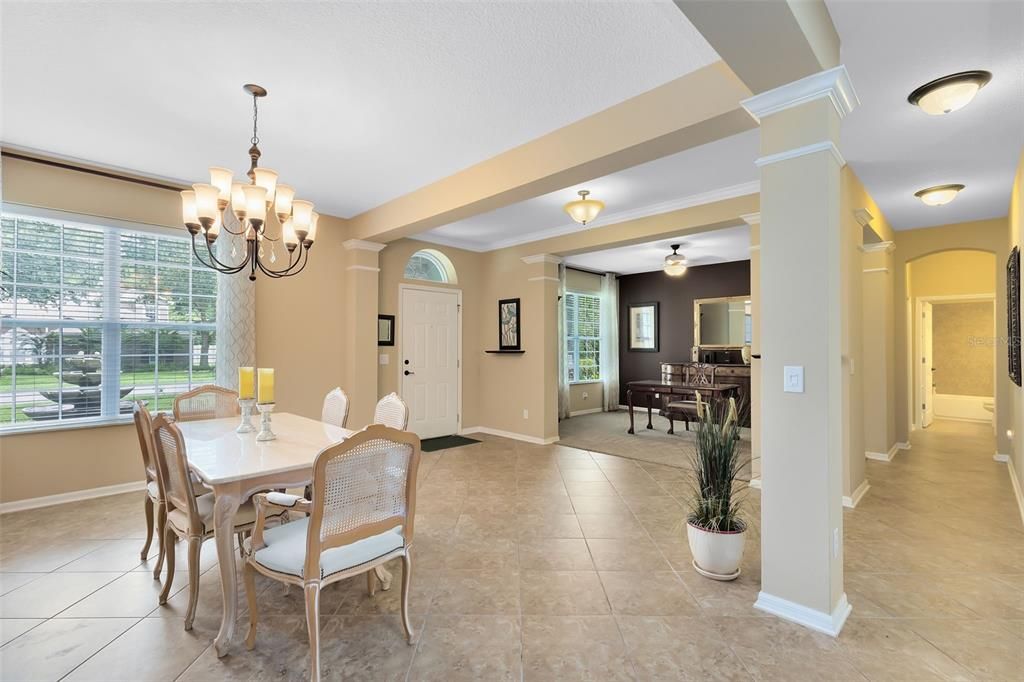 A view from the dining room to the foyer and into the formal livinv room.