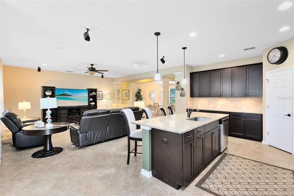 View from dinette area into kitchen and family room.