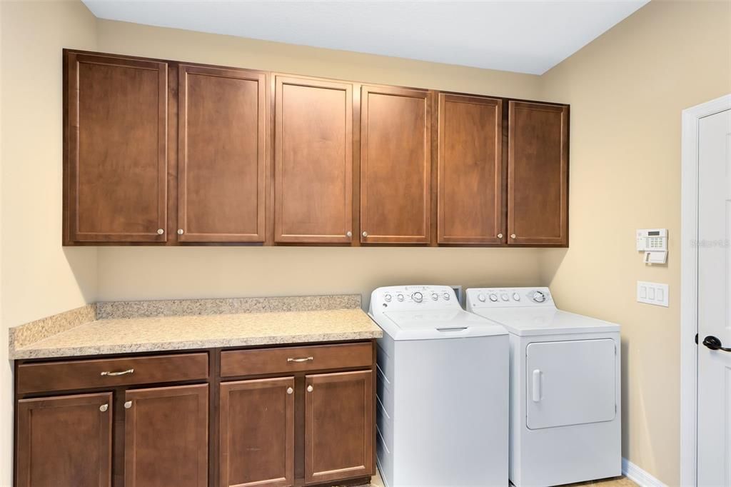 You'll enjoy a large laundry room with counter and cabinet space.