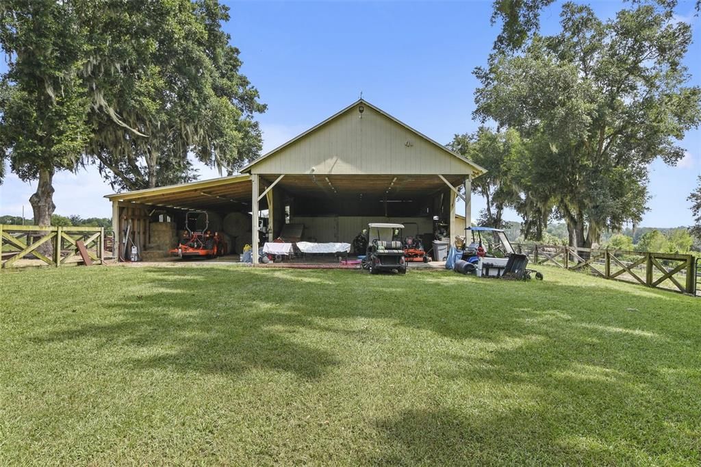 Barn offering 2 stalls and 4 pens.