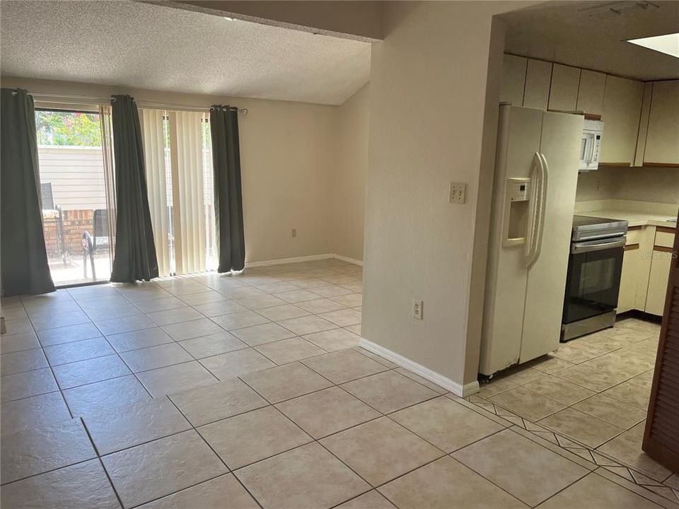 Dining room looking to living room and kitchen.