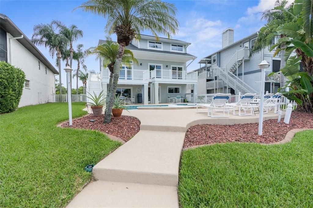 view of yard and pool from seawall.