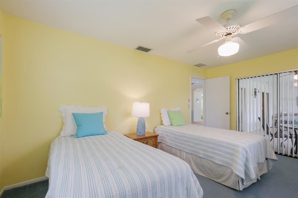 bedroom 3 has sliding door to enclosed lanai