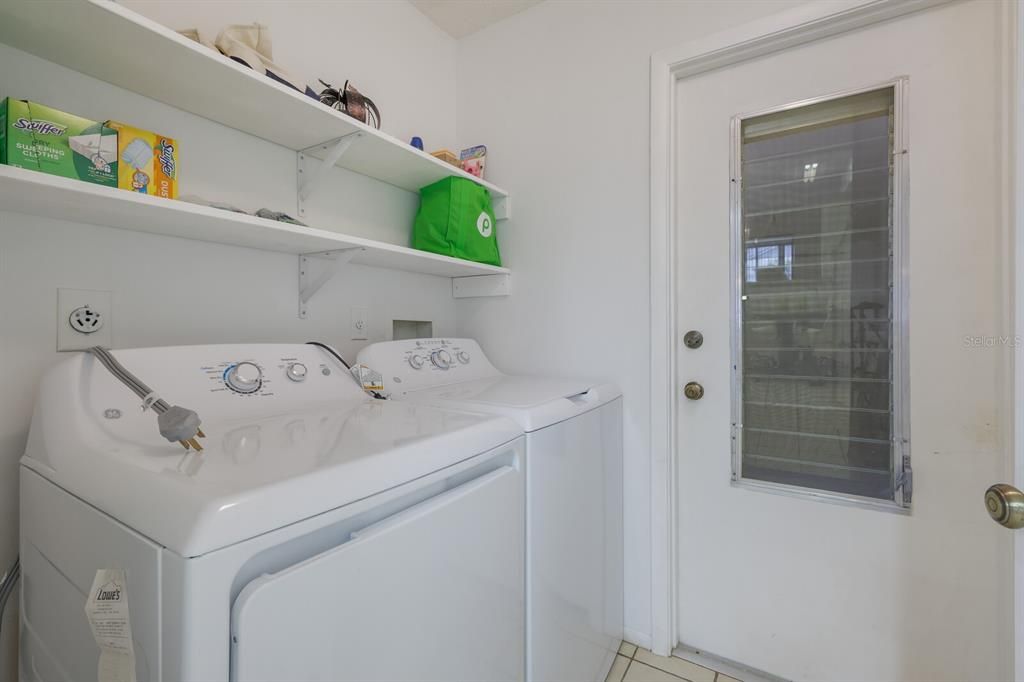 Interior laundry room off the kitchen and door to the garage - storage closet too