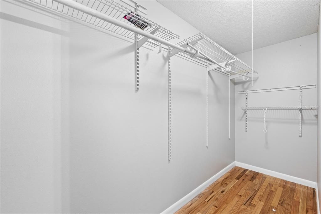 Primary bedroom walk-in closet