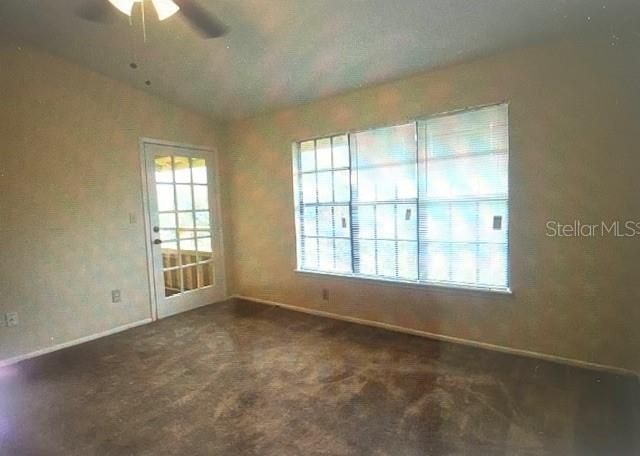 Open and airy living room with access to private balcony