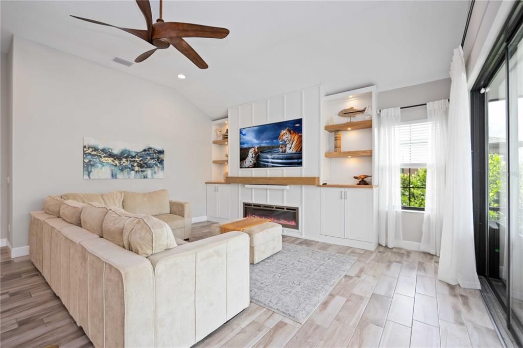 Family Room with fire place and build in shelving