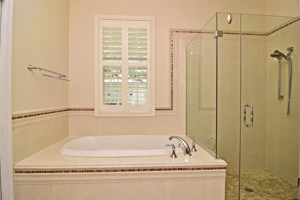 Primary Suite Separate Garden Tub and Glass Door Shower