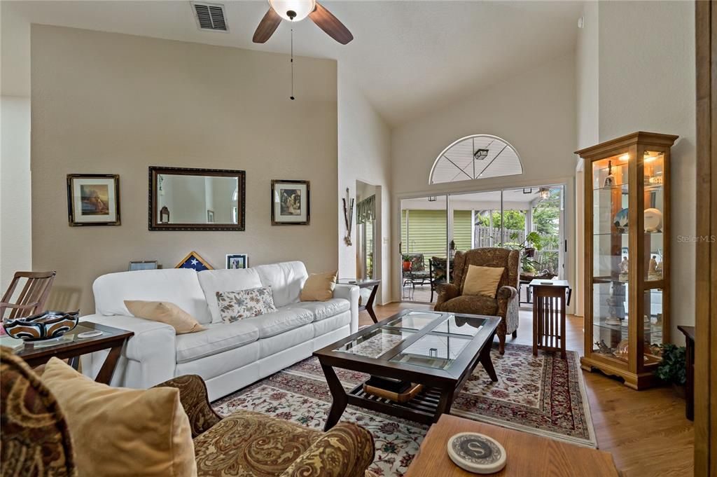 Living Room with Triple Sliding Doors to Screened Lanai