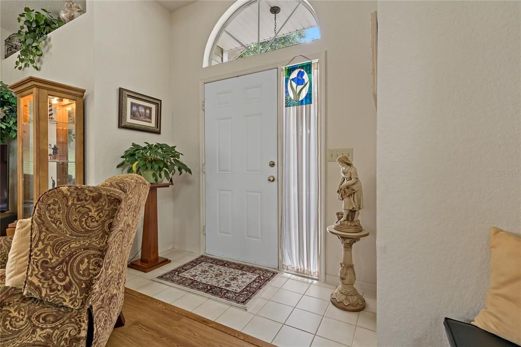 Front Door and Foyer with Arched Transom Window