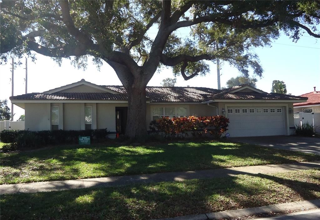 Front with shade tree