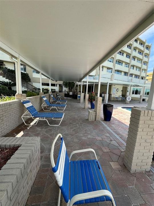 Covered area by the pool.