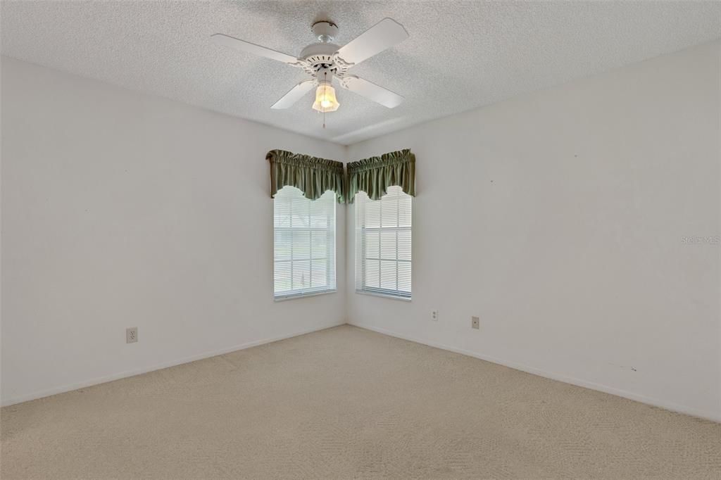 Updated windows & ceiling fan in this bedroom also~