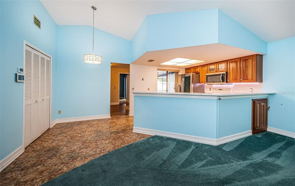 Open kitchen with snack bar and large pantry.