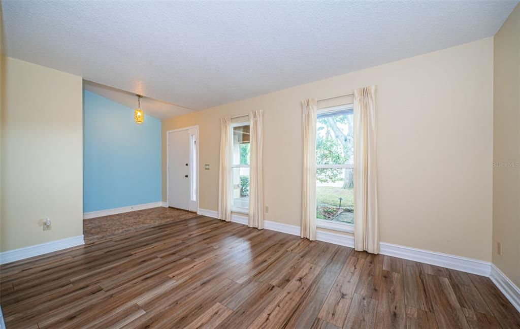 L-shaped living and dining room.