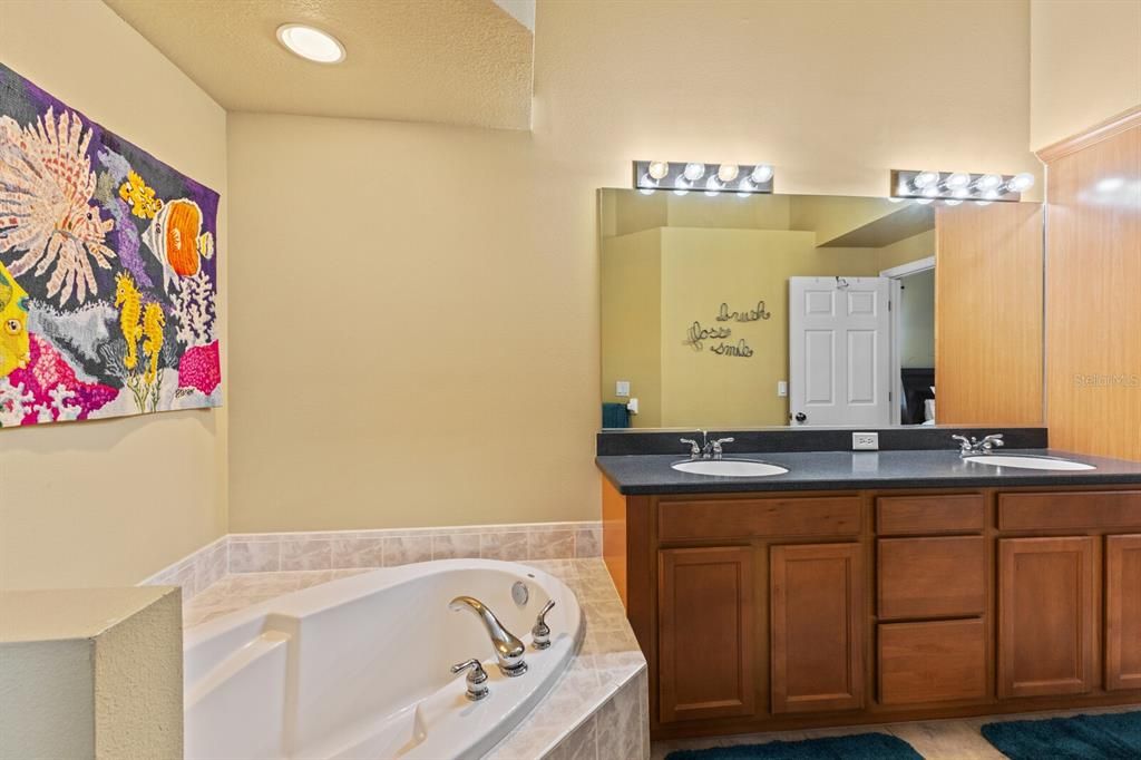 Large garden tub with dual sink vanity