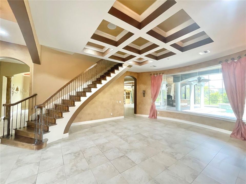 living room with staircase entry