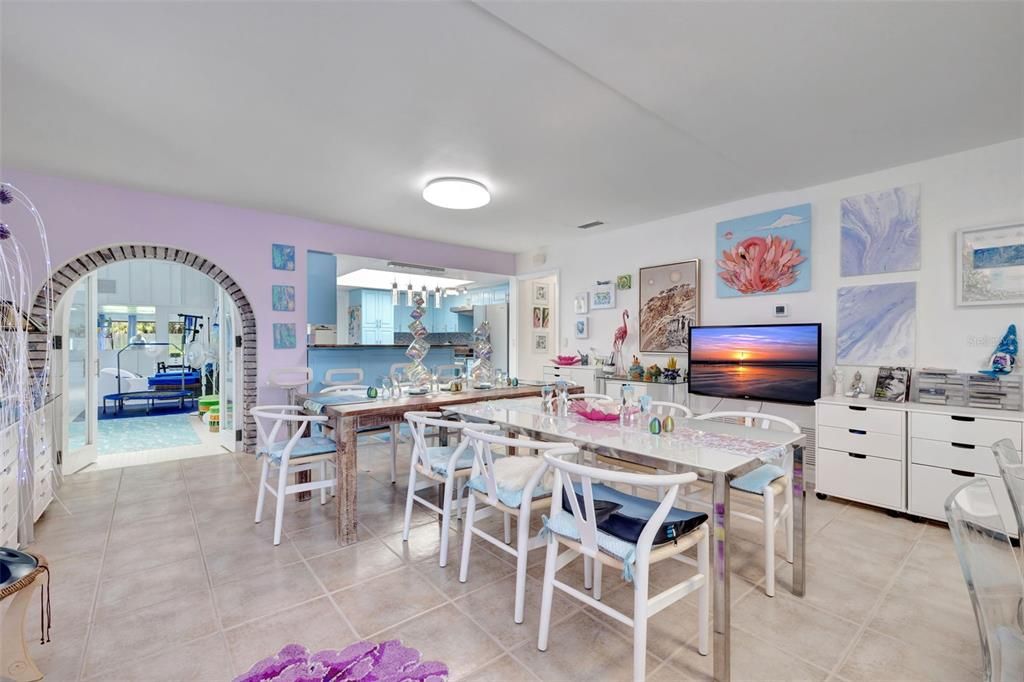 Dining room; pool area is behind the arch.