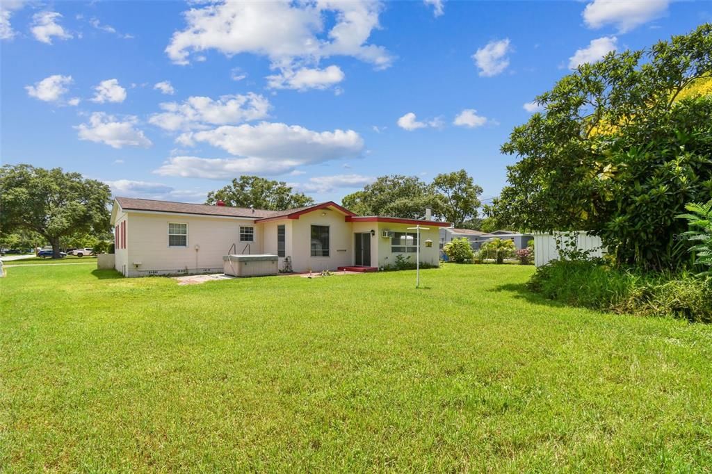 Huge pool-sized backyard. Partial fencing. 2 sheds