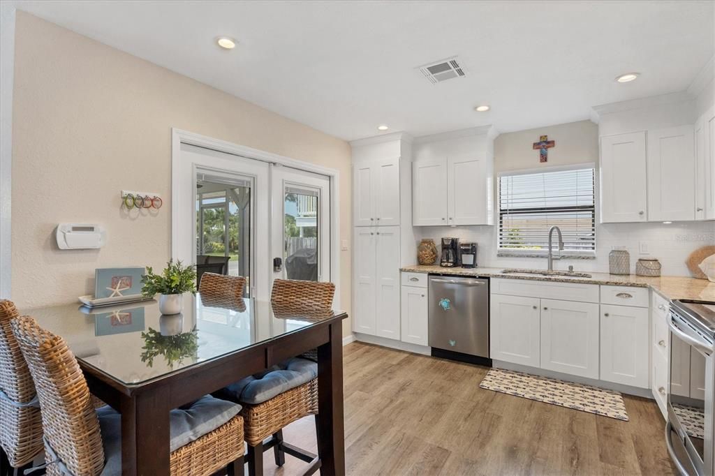 French doors walk in/out of front screened porch &  boast double pane w/ built in mini blinds between the glass.