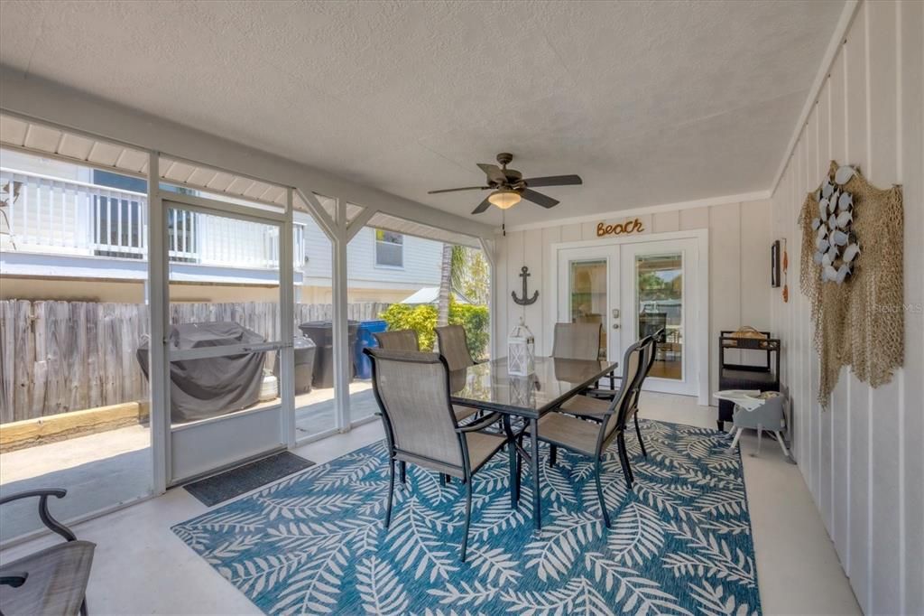 Front Screened Porch/Left Side Door Entrance Approx. 19X12. French doors walk in/out of kitchen and boast double pane & built in window mini blinds between glass.