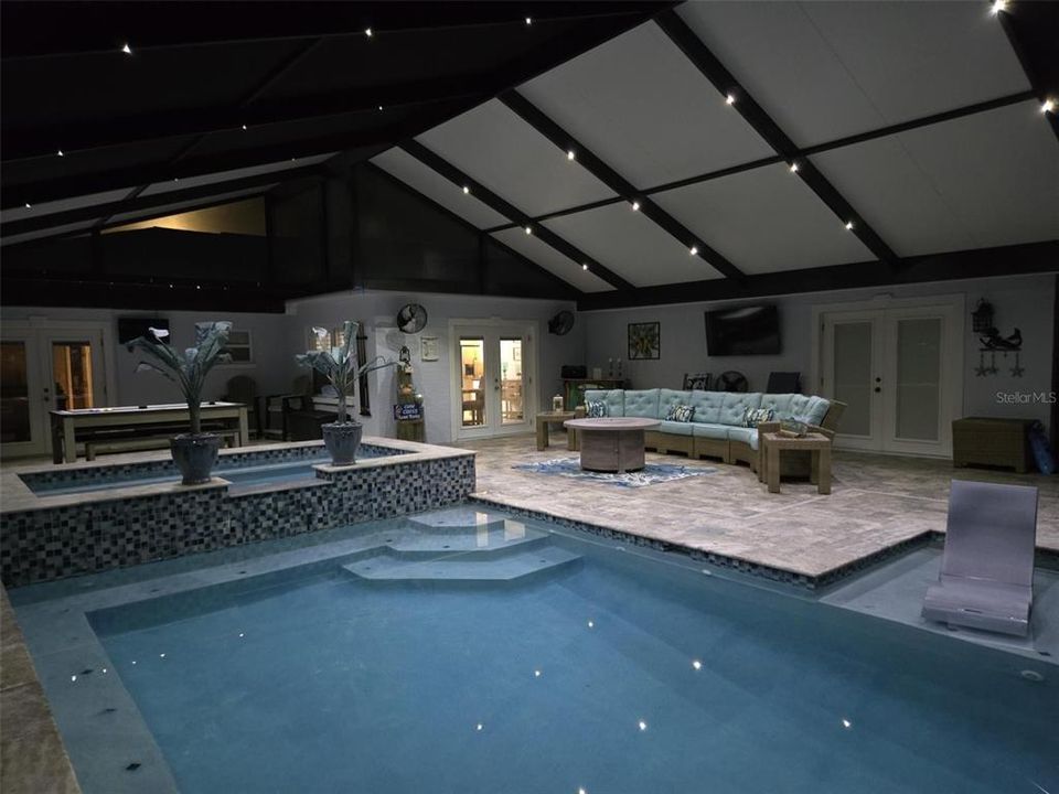 Pool area with lights on at night