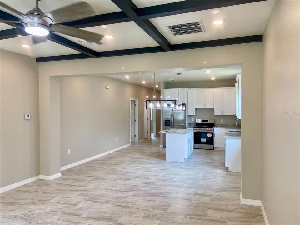 great room, coffered ceiling to open kitchen