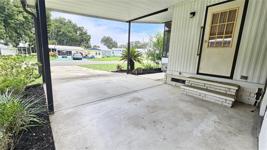 Covered parking next to kitchen entrance