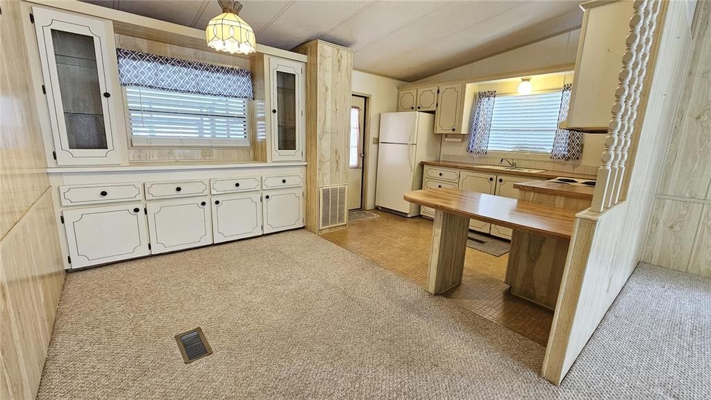 Dining room w/ built-in shelving & cabinets