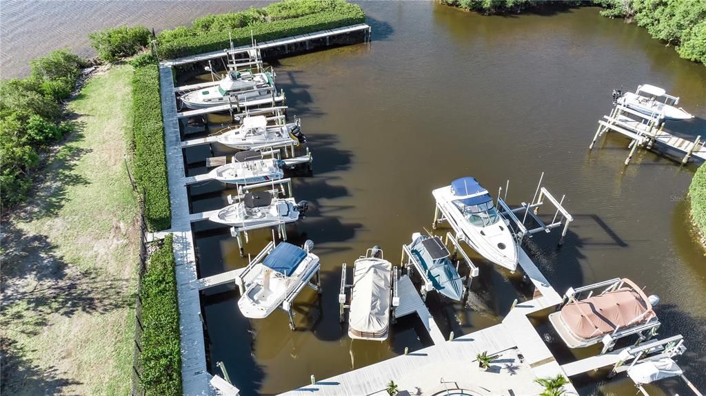 Boat slip is the where the pontoon boat is with the brown cover