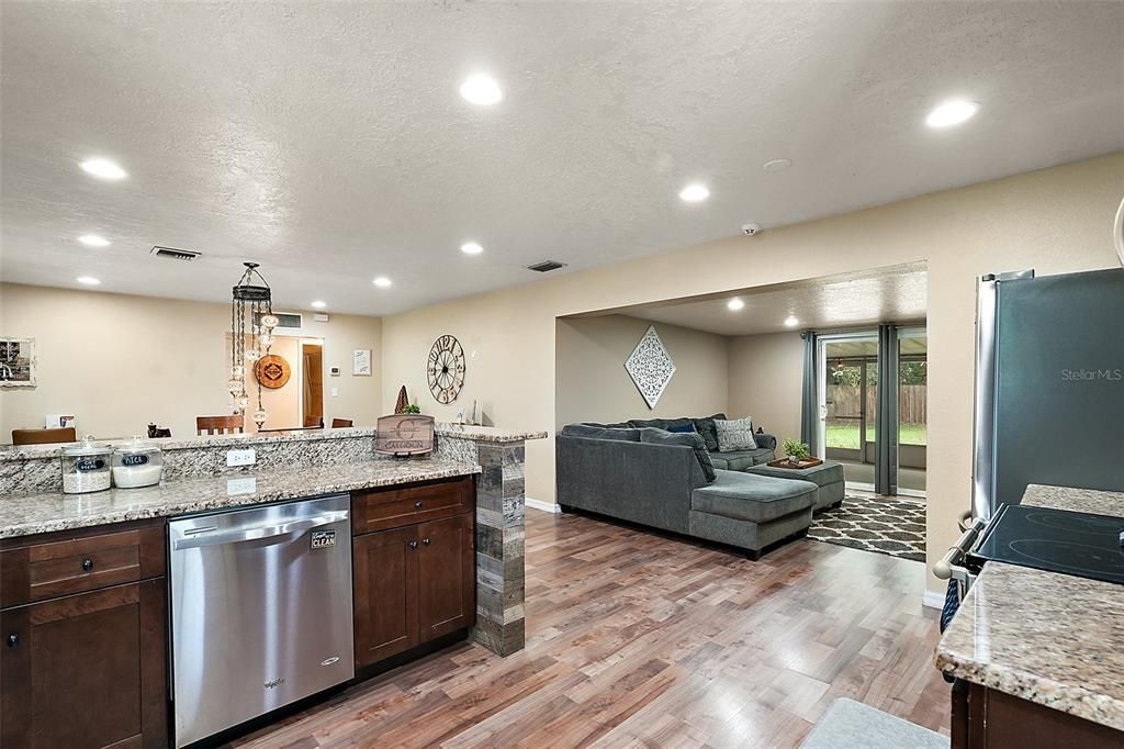 KITCHEN VIEW TO DINING AREA AND LIVING ROOM