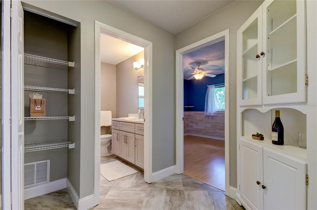 Hallway between Bath #2, Beds #2 & #3.. Nice Linen Closet and Sharp Looking Built In Corner Cabinet!