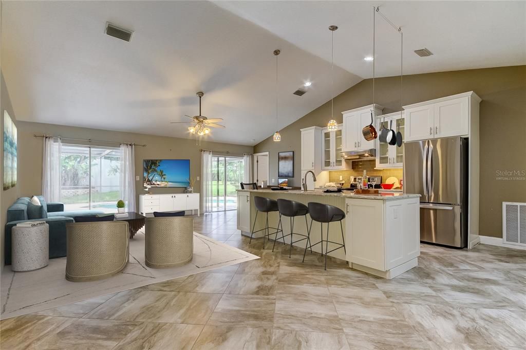 Virtually Staged: More Ways Than You Think at 1st Site on How to Furnish the Living Room! Here's an option of putting TV in between Sliding Glass Doors! Use the Nook to the Right of Kitchen as an Office! *SEE the Hanging Pots n Pans Rack?