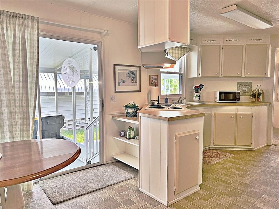 View of side entry and screened in carport