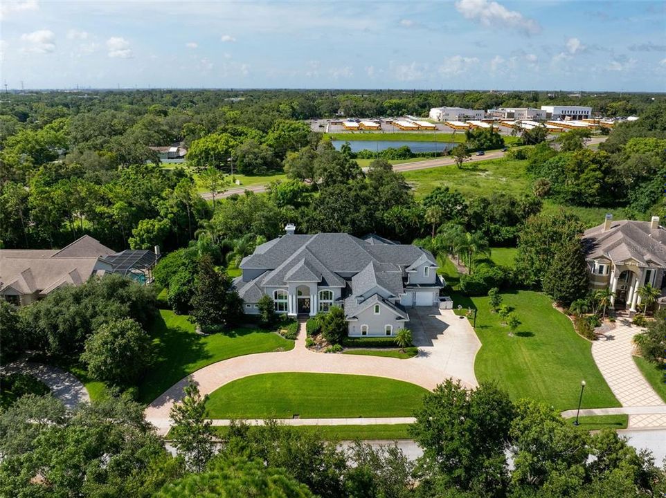 Drone view facing south showing front of home side of property