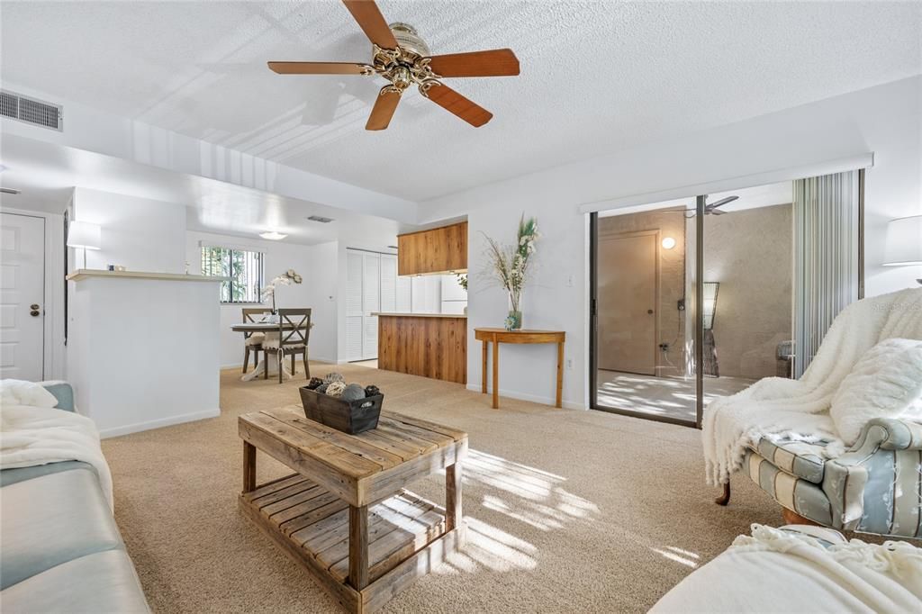 This view shows the balance of the main Living Space - The Dining area, Kitchen and Bonus/Lanai space.