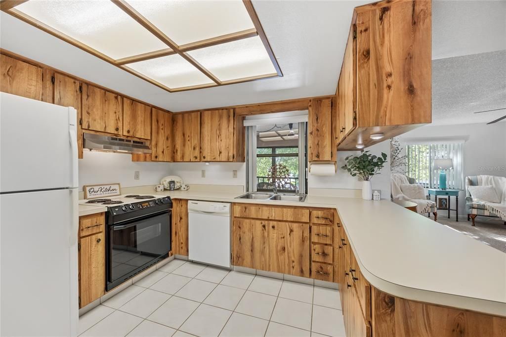 A window over the Kitchen sink provides a pass thru to the Bonus Space/Lanai.