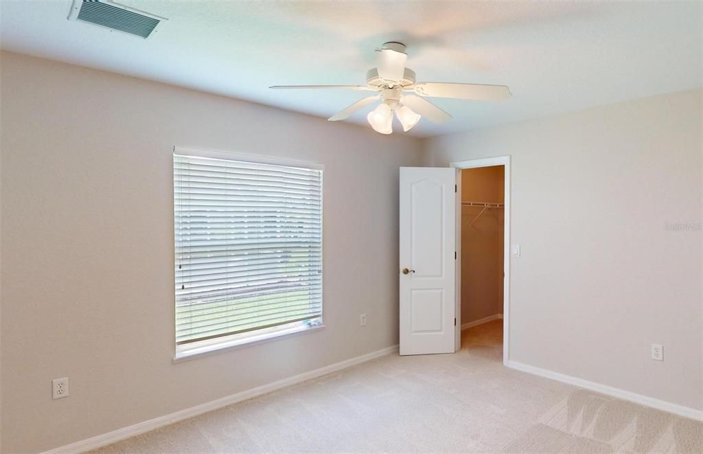 Bedroom #1 with walk-in closet.