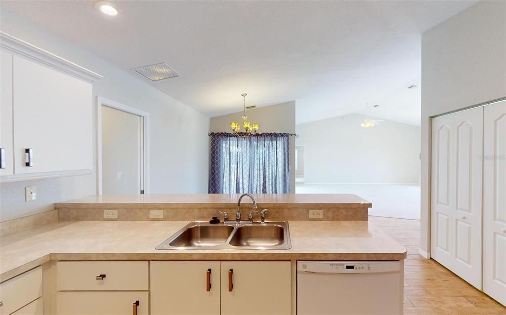 Kitchen opens to the dining nook and living room.