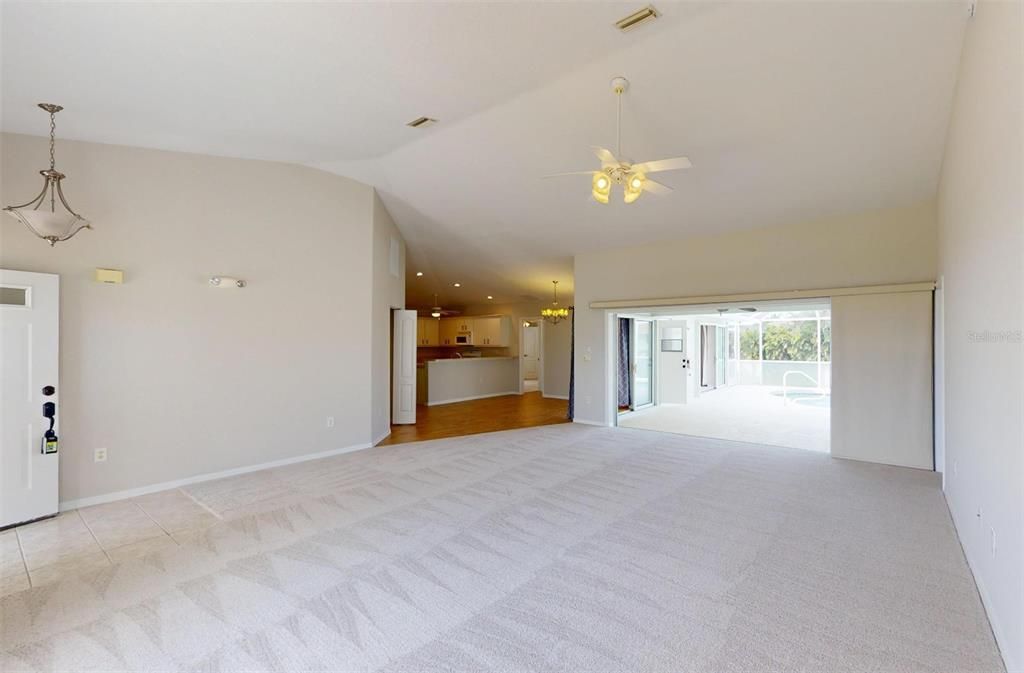 Looking from Living Room toward Kitchen & Sliding Glass Door to Lanai & Pool