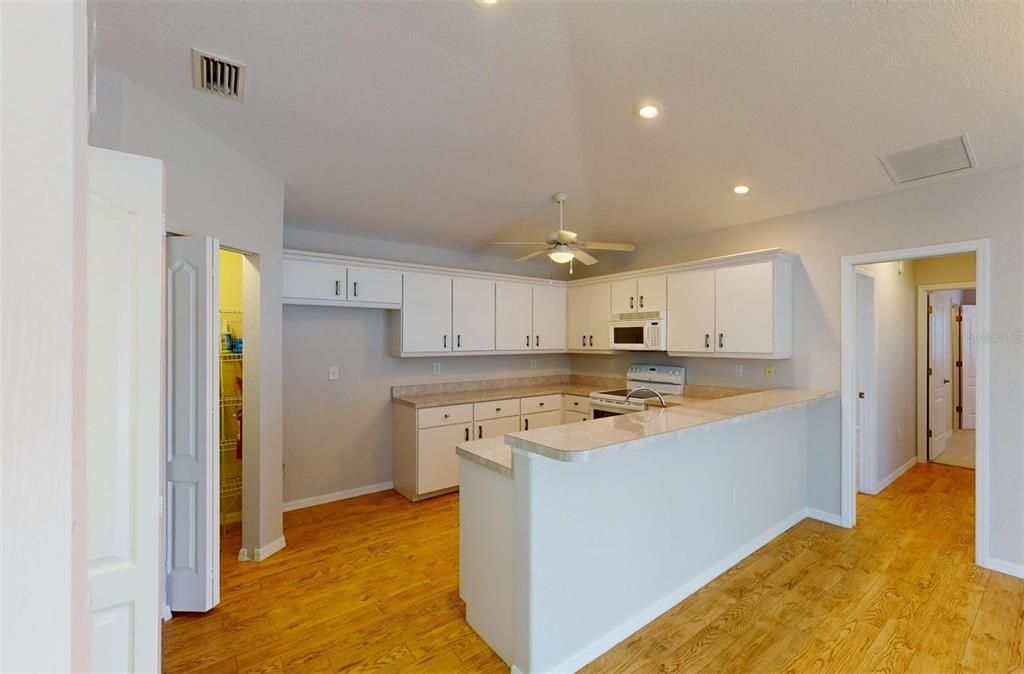 Breakfast Bar with Can Lighting above.