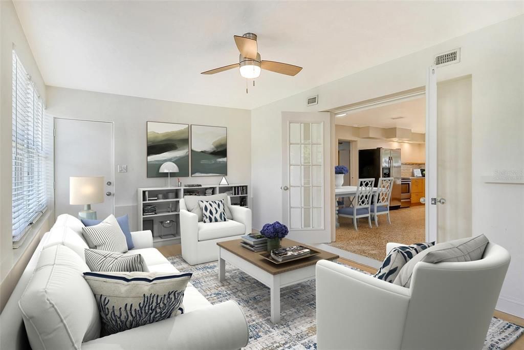 Family room off the kitchen with french doors (virtually staged)