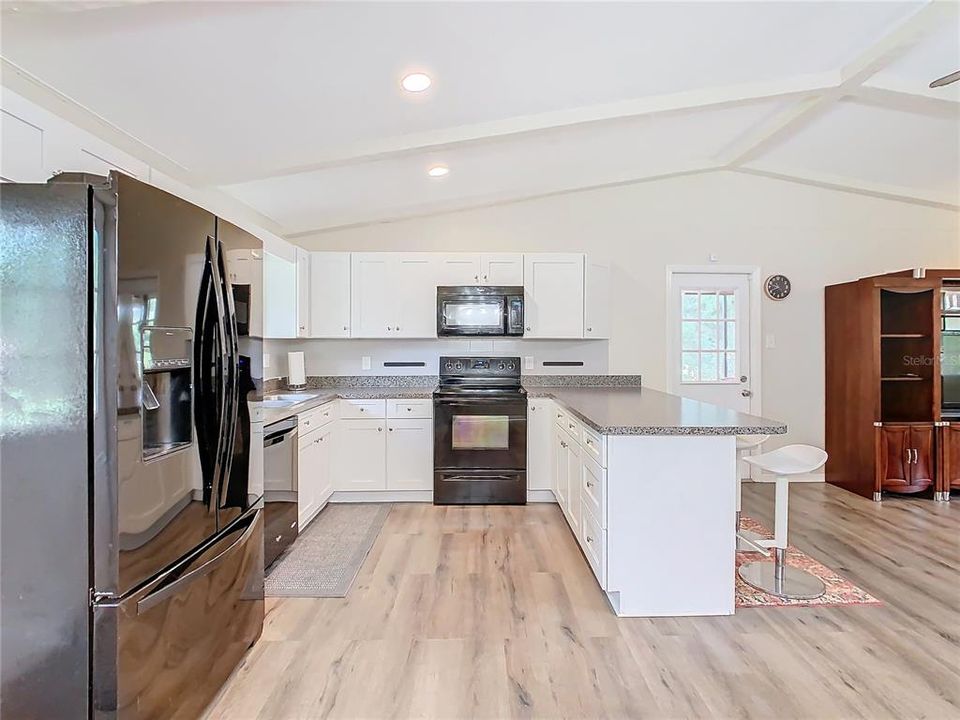 The kitchen has been remodeled with new cabinets, counter top and appliances.