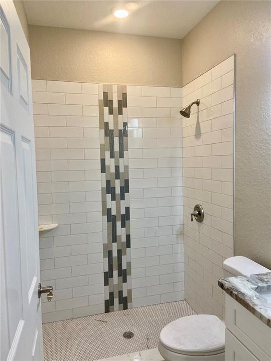 hall bath with tiled walk in shower