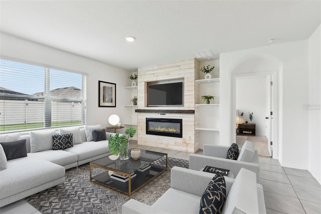 The kitchen is open to the dining area and living room complete with an ELECTRIC FIREPLACE centered between BUILT-IN SHELVING for added character. Virtually Staged.