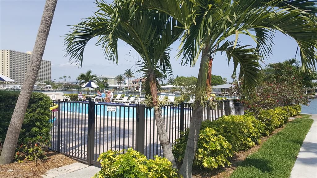 One of 6 community pools located right next to this unit/building and offers poolside bathrooms.