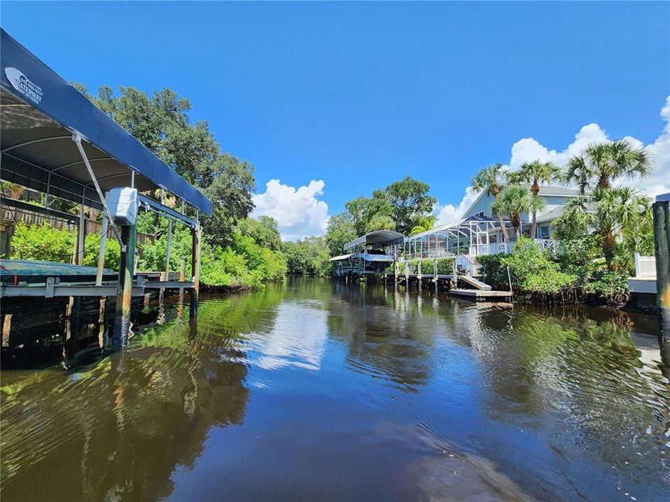 Terminus of canal back towards entrance. Lot is in the light green trees on the left.