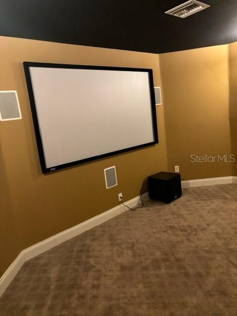 Media room with six reclining loungers.