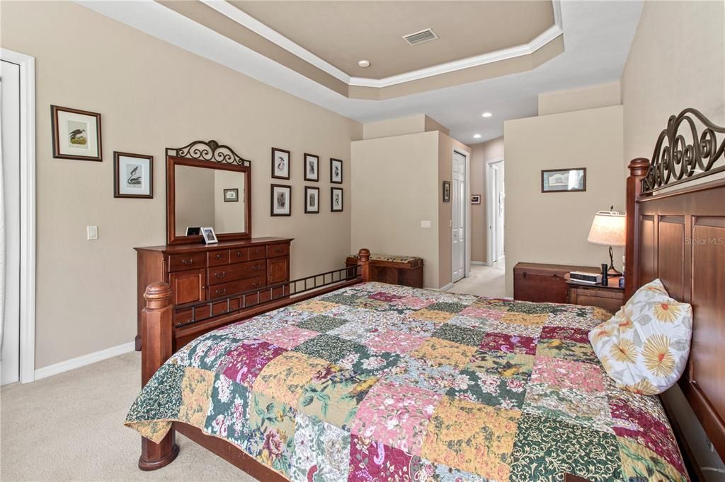 primary bedroom with tray ceiling